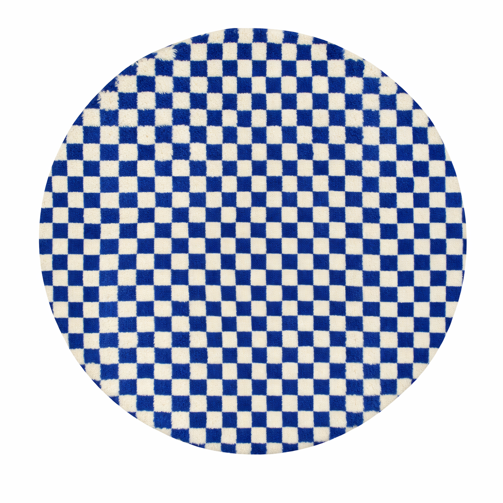 Handmade round blue and ivory Moroccan wool rug featuring a bold checkerboard geometric pattern.