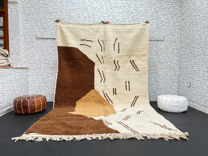 Handmade Moroccan wool rug with brown and beige abstract desert-inspired design
