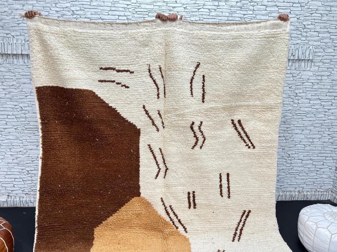Handmade Moroccan wool rug with brown and beige abstract desert-inspired design