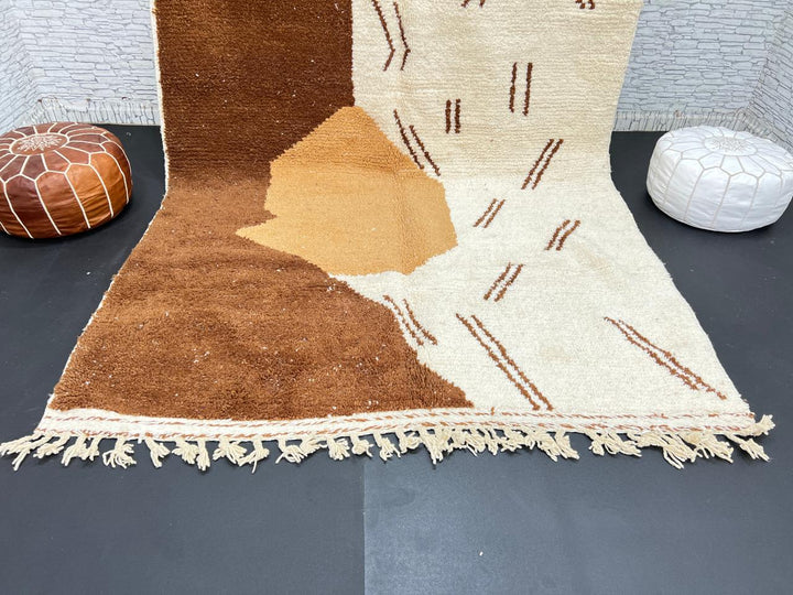 Handmade Moroccan wool rug with brown and beige abstract desert-inspired design