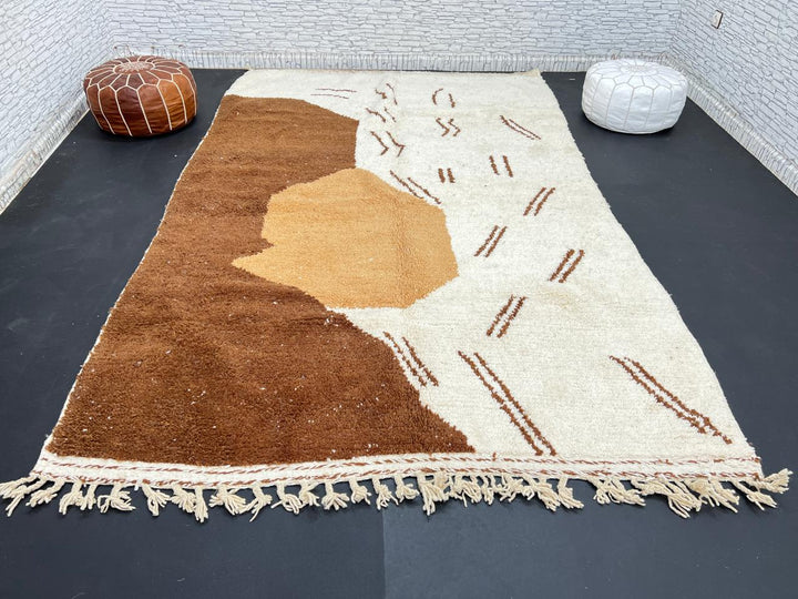 Handmade Moroccan wool rug with brown and beige abstract desert-inspired design