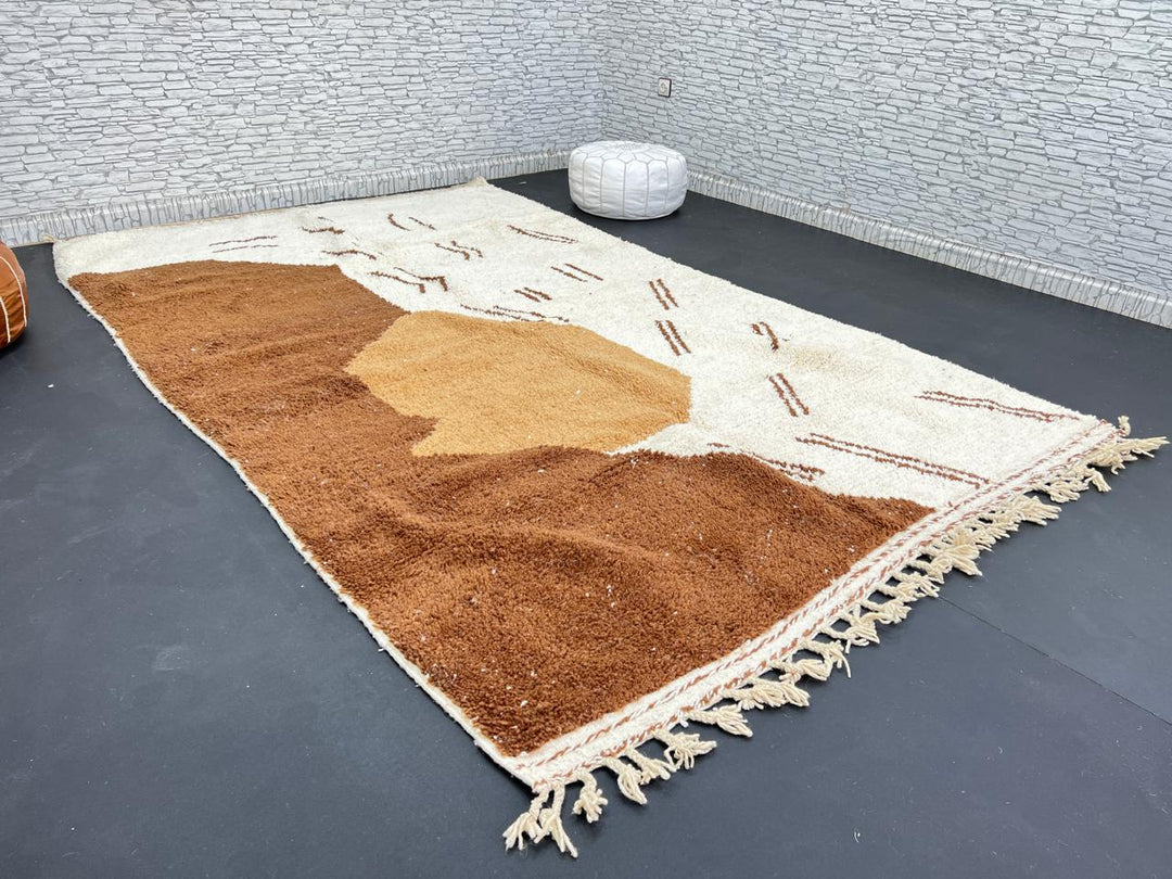 Handmade Moroccan wool rug with brown and beige abstract desert-inspired design