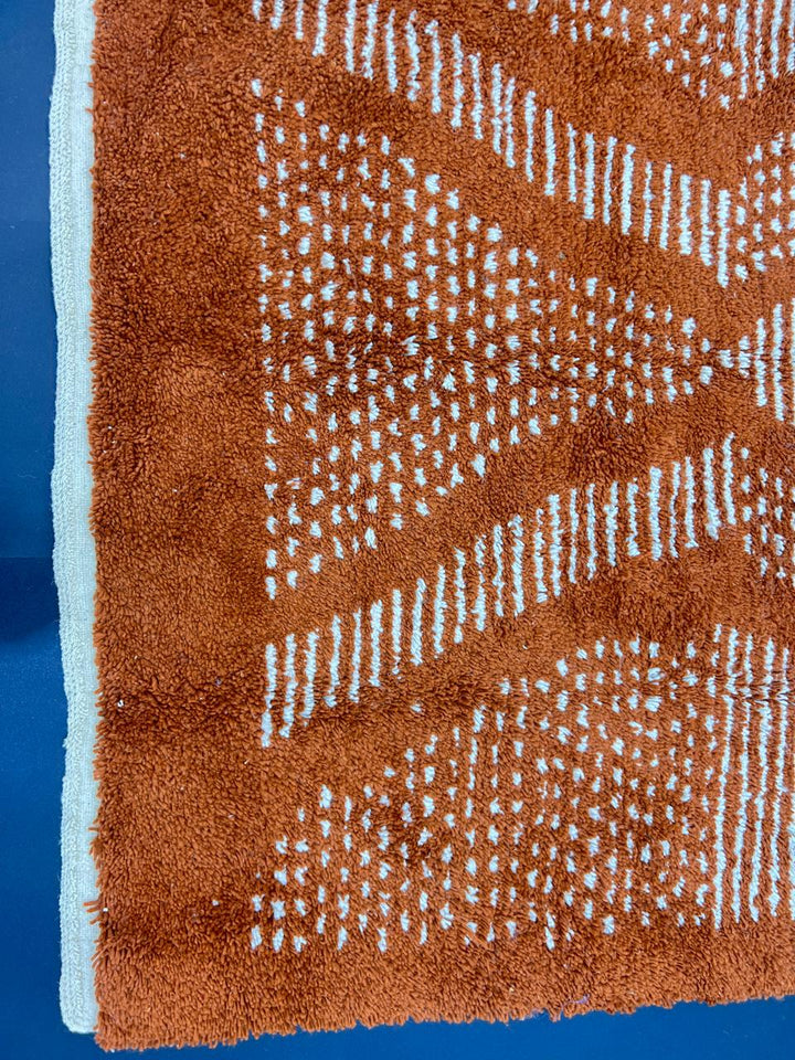 Handwoven cinnamon brown Moroccan wool runner rug with ivory flowing geometric pattern