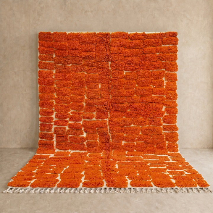 Handmade burnt orange Moroccan wool rug with ivory checkerboard pattern – Beni Mrirt design