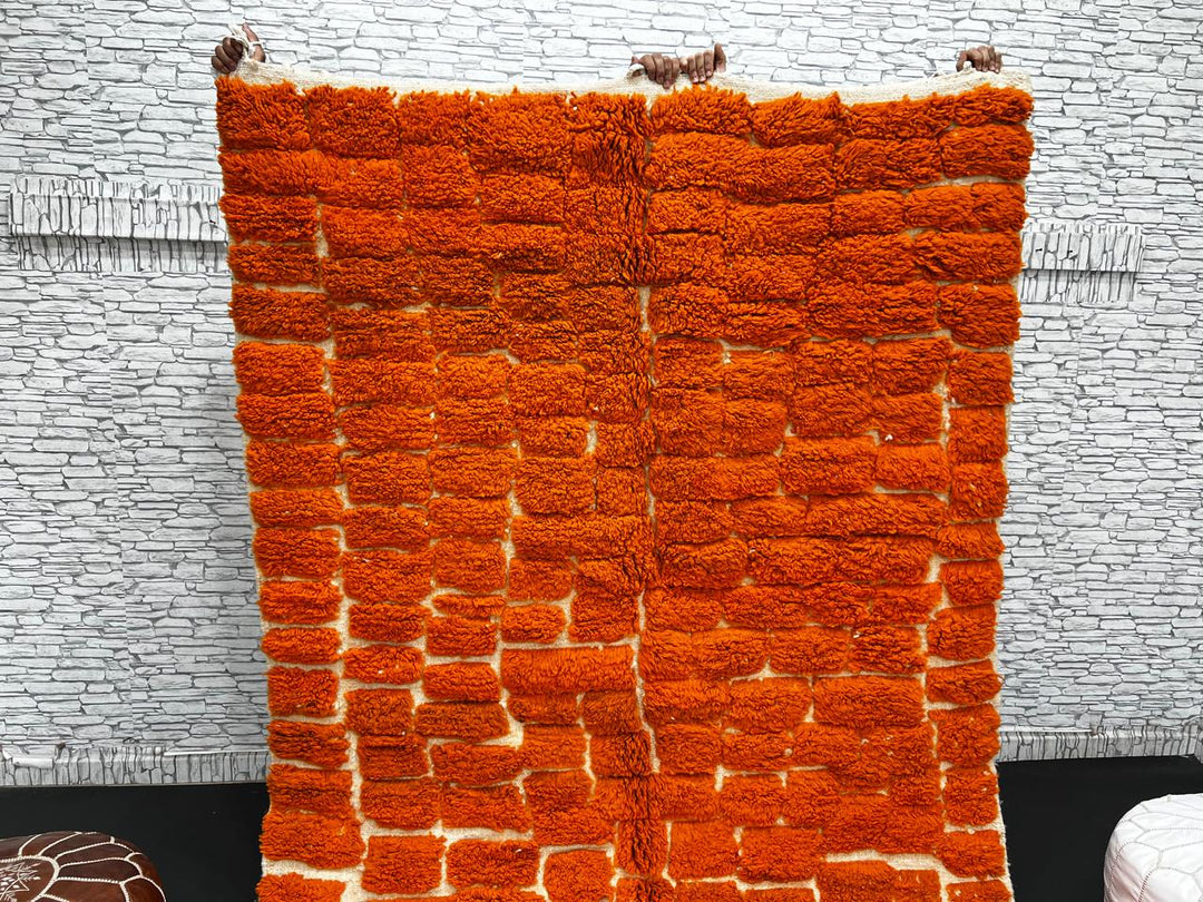 Handmade burnt orange Moroccan wool rug with ivory checkerboard pattern – Beni Mrirt design