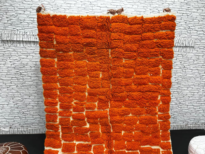 Handmade burnt orange Moroccan wool rug with ivory checkerboard pattern – Beni Mrirt design