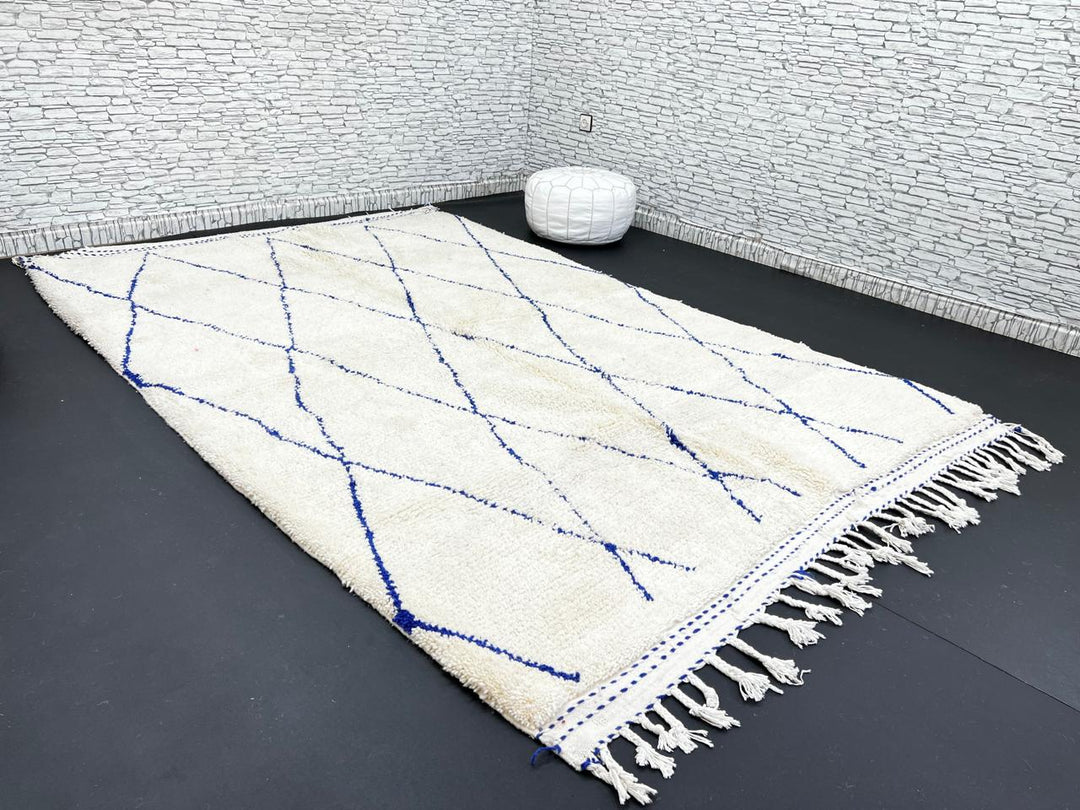 Ivory Moroccan wool rug with cobalt blue diamond lattice handmade by Berber artisans
