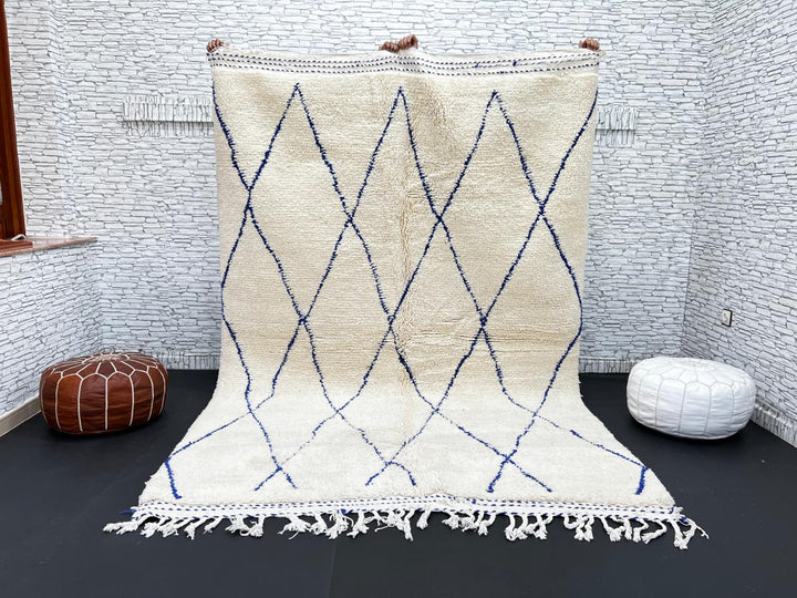 Ivory Moroccan wool rug with cobalt blue diamond lattice handmade by Berber artisans