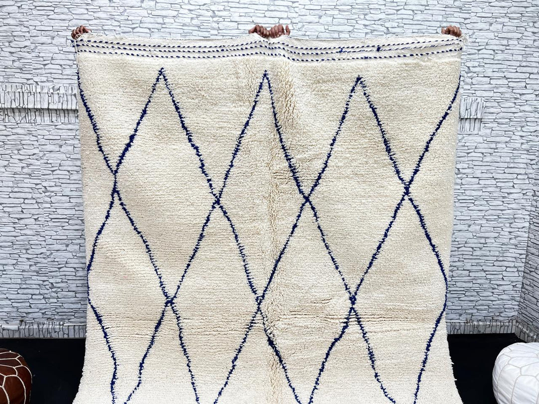 Ivory Moroccan wool rug with cobalt blue diamond lattice handmade by Berber artisans
