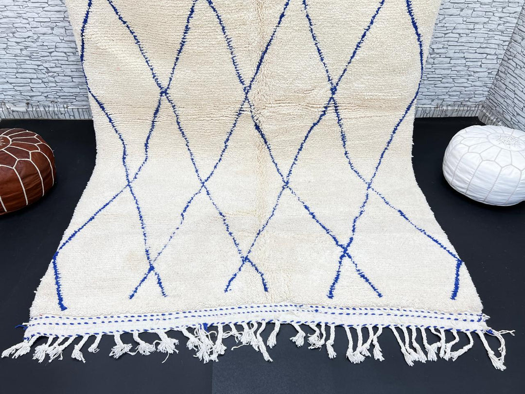 Ivory Moroccan wool rug with cobalt blue diamond lattice handmade by Berber artisans
