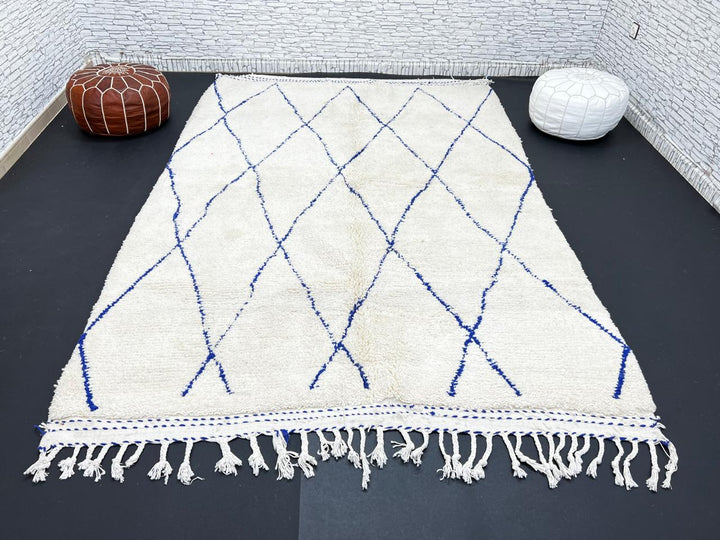 Ivory Moroccan wool rug with cobalt blue diamond lattice handmade by Berber artisans