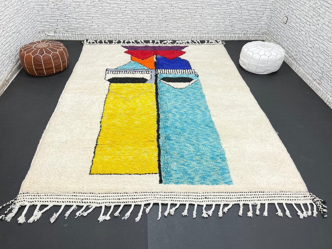 Handwoven Moroccan wool rug with bold geometric color blocks in blue, yellow, and red