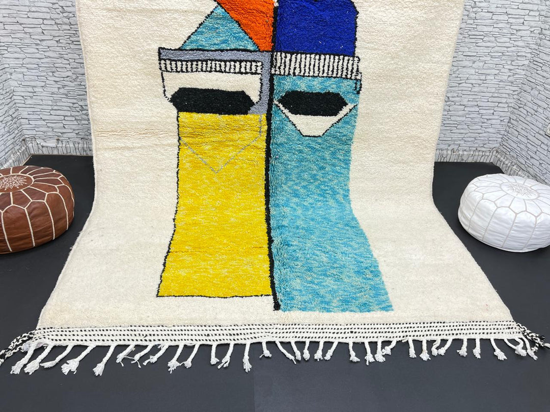 Handwoven Moroccan wool rug with bold geometric color blocks in blue, yellow, and red