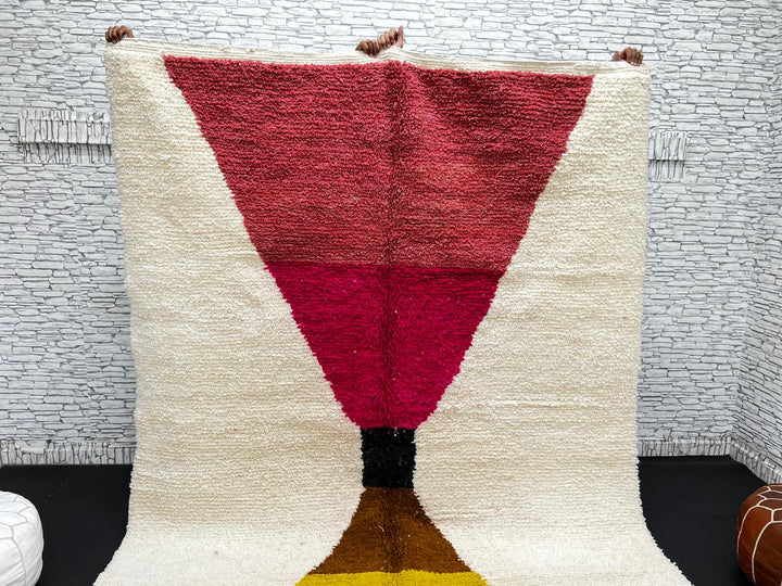 Handmade Moroccan wool rug in red, pink, mustard yellow, and cream – geometric Berber design
