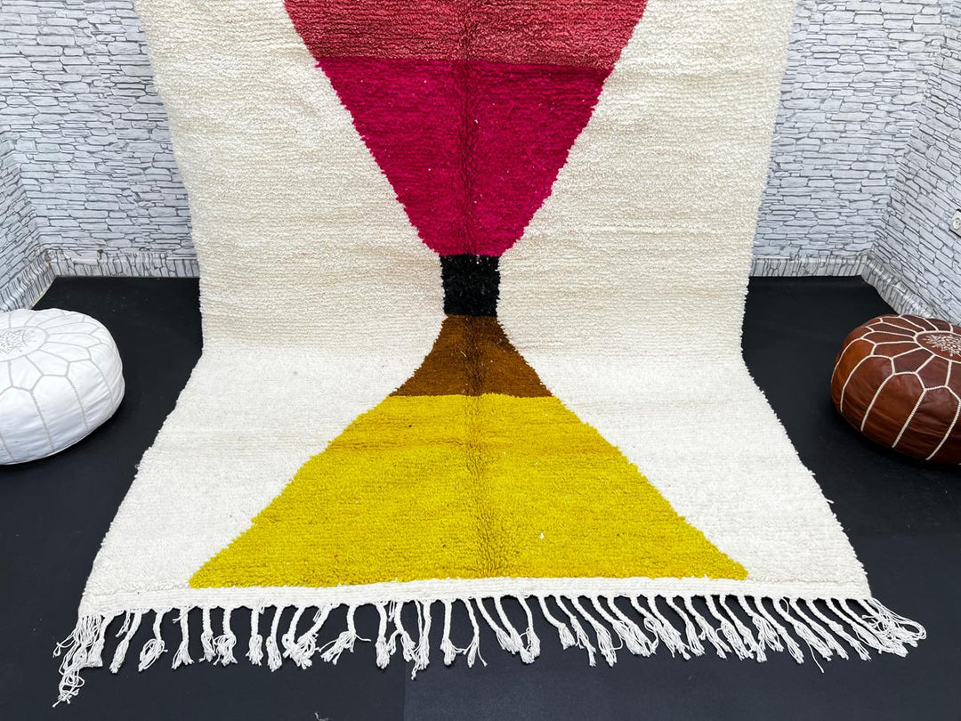 Handmade Moroccan wool rug in red, pink, mustard yellow, and cream – geometric Berber design