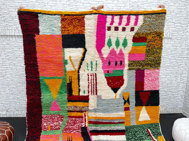 Colorful Moroccan wool rug handmade with coral pink, green, and mustard geometric patterns