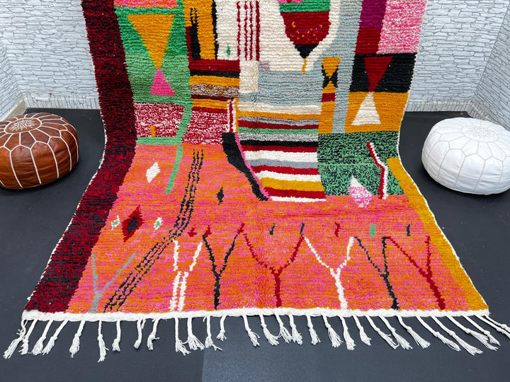 Colorful Moroccan wool rug handmade with coral pink, green, and mustard geometric patterns