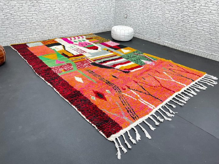 Colorful Moroccan wool rug handmade with coral pink, green, and mustard geometric patterns