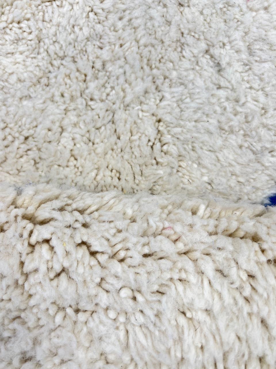 Colorful abstract Moroccan wool rug with pink, blue, yellow, and green geometric design