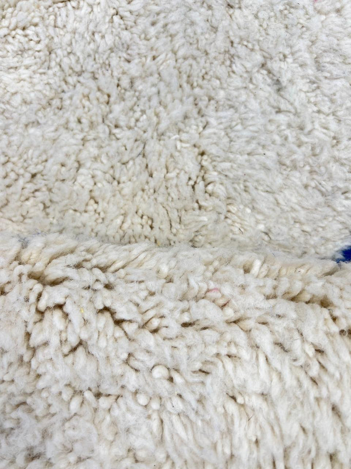 Colorful abstract Moroccan wool rug with pink, blue, yellow, and green geometric design