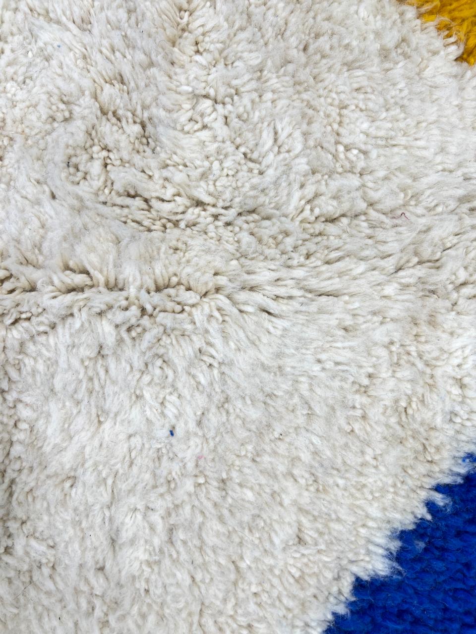 Colorful abstract Moroccan wool rug with pink, blue, yellow, and green geometric design