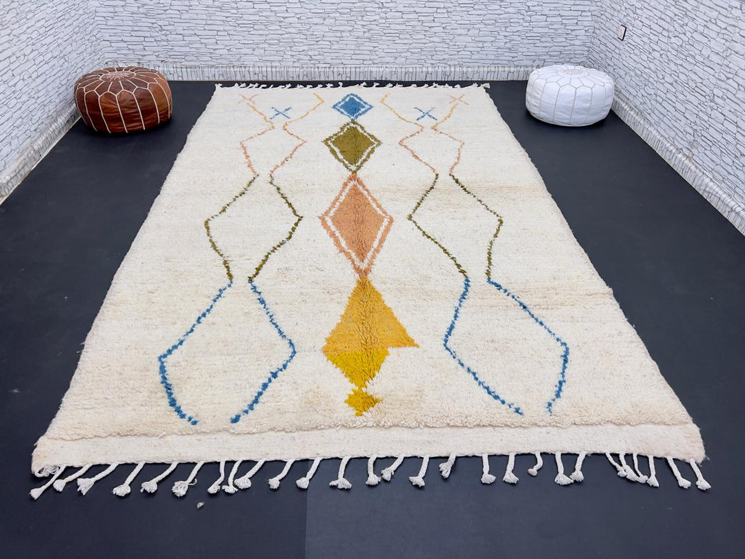 Handwoven Moroccan wool rug with colorful diamond geometric design on ivory background
