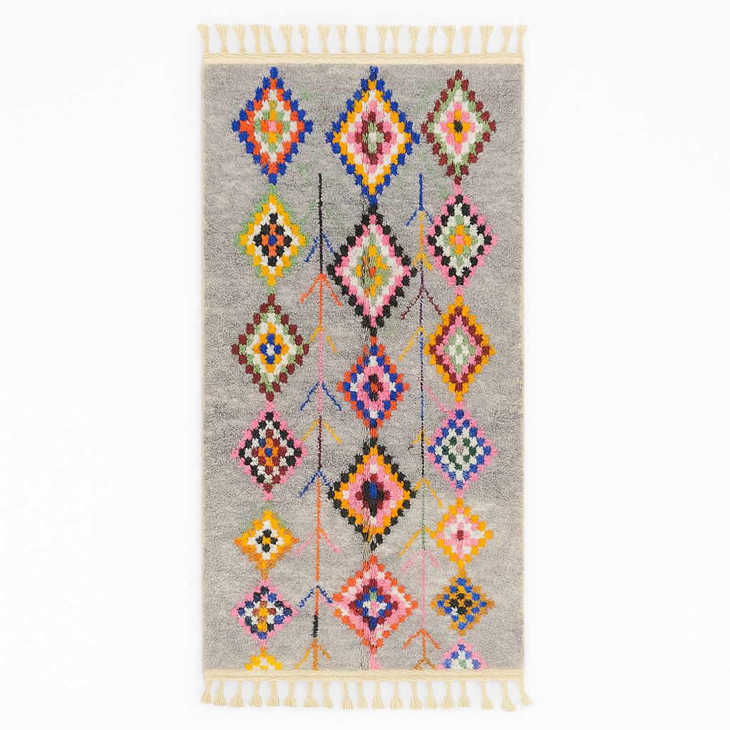 Colorful Moroccan wool runner rug with multicolor diamond patterns on a gray background