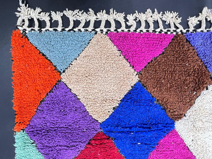 Handwoven colorful Moroccan wool runner rug with multicolor diamond pattern