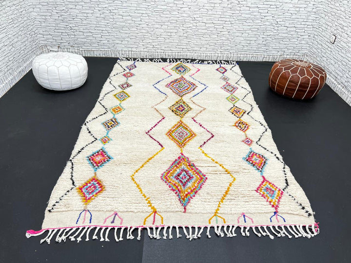 Handmade Moroccan wool rug with colorful diamond patterns on cream background – Berber boho carpet