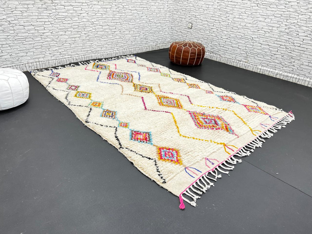 Handmade Moroccan wool rug with colorful diamond patterns on cream background – Berber boho carpet