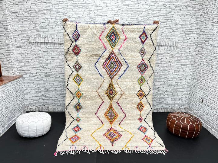 Handmade Moroccan wool rug with colorful diamond patterns on cream background – Berber boho carpet