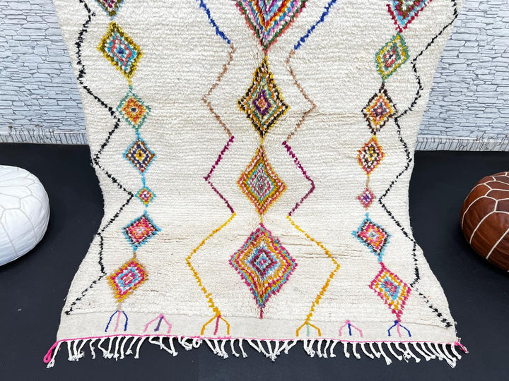 Handmade Moroccan wool rug with colorful diamond patterns on cream background – Berber boho carpet