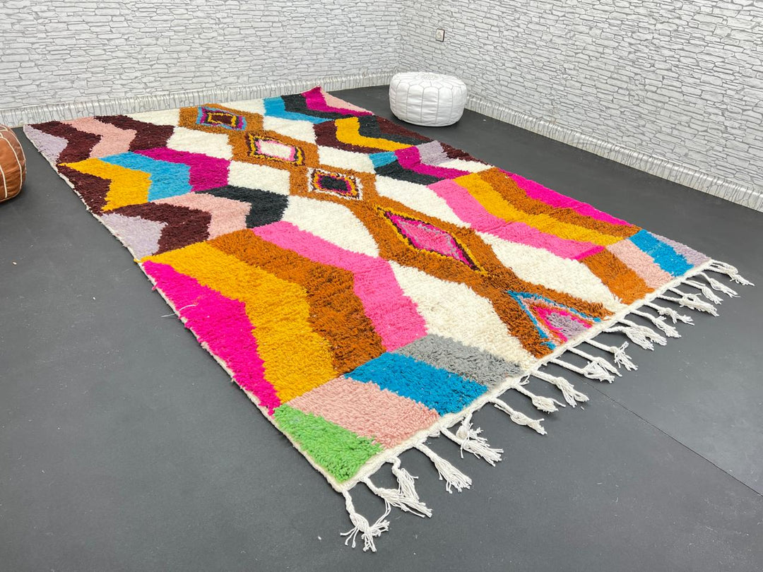 Colorful Moroccan Azilal wool rug with geometric diamond pattern in vibrant hues