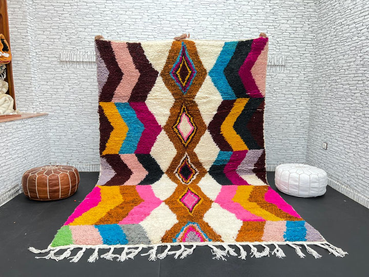 Colorful Moroccan Azilal wool rug with geometric diamond pattern in vibrant hues