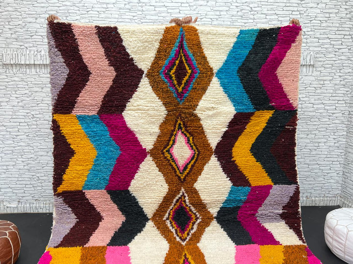 Colorful Moroccan Azilal wool rug with geometric diamond pattern in vibrant hues