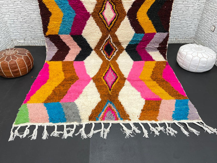 Colorful Moroccan Azilal wool rug with geometric diamond pattern in vibrant hues