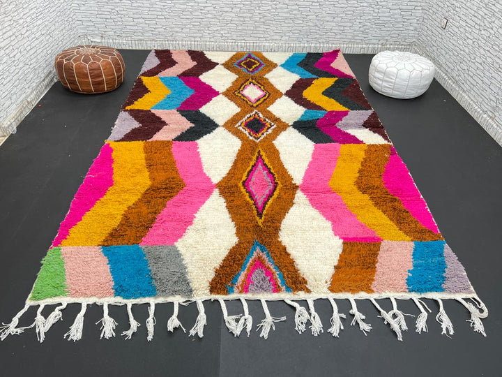 Colorful Moroccan Azilal wool rug with geometric diamond pattern in vibrant hues