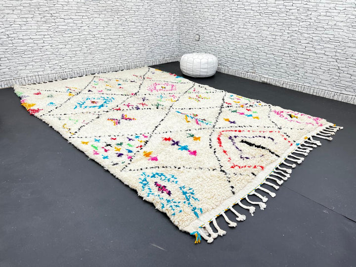 Colorful Moroccan wool rug with multicolor geometric diamond patterns, handmade by Berber artisans