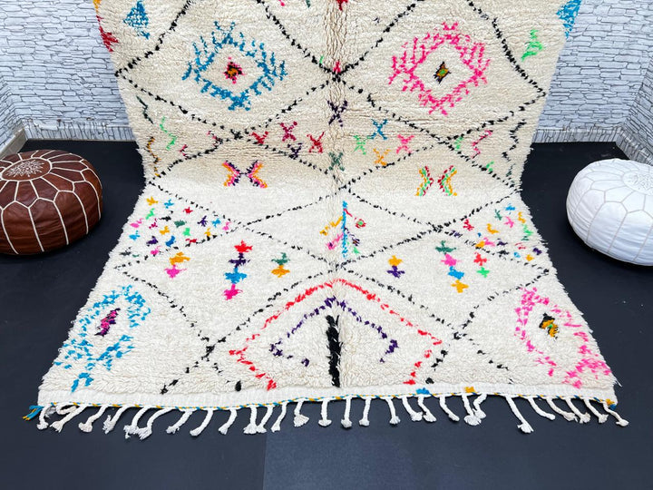 Colorful Moroccan wool rug with multicolor geometric diamond patterns, handmade by Berber artisans