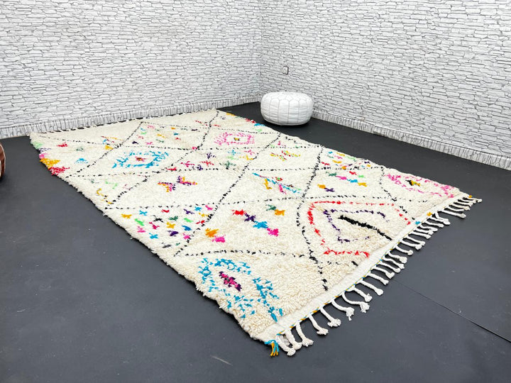 Colorful Moroccan wool rug with multicolor geometric diamond patterns, handmade by Berber artisans
