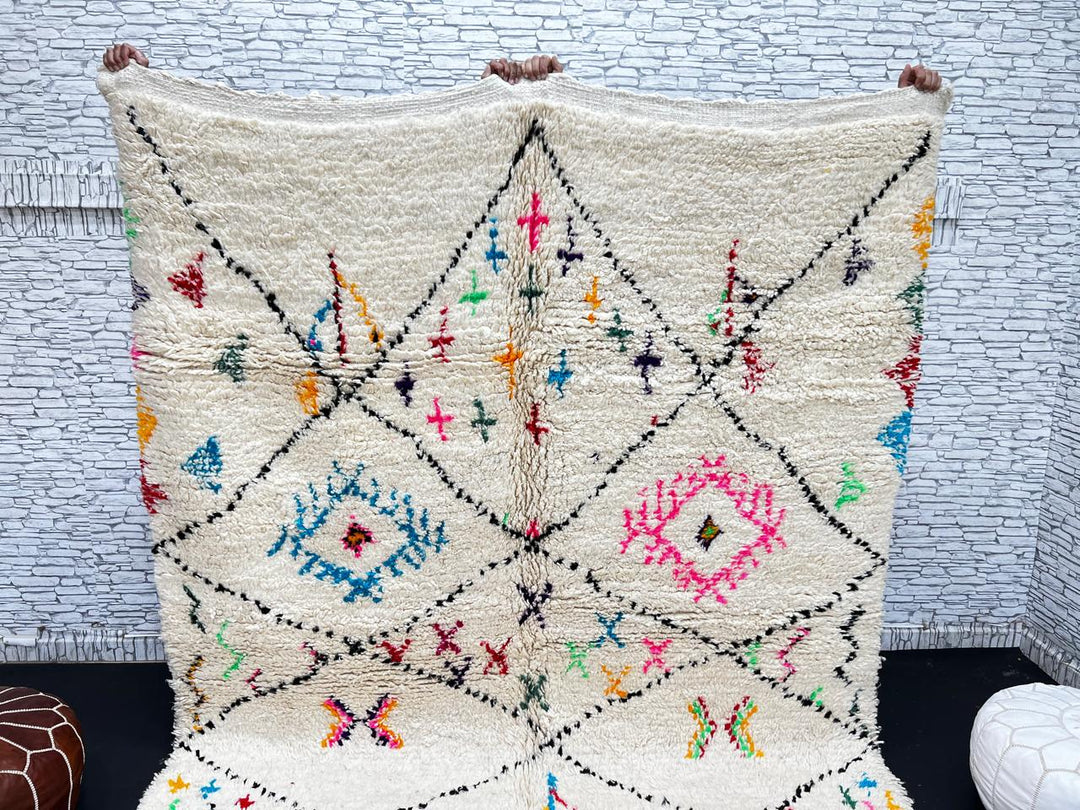 Colorful Moroccan wool rug with multicolor geometric diamond patterns, handmade by Berber artisans