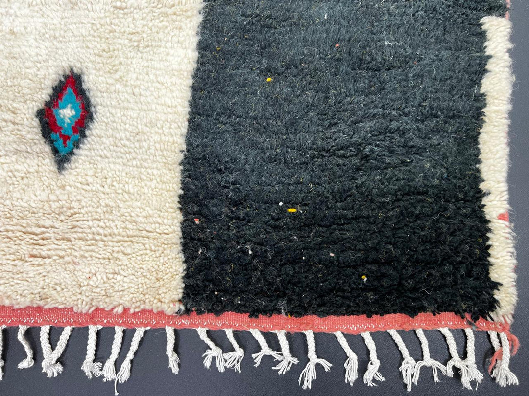 Handmade colorful Moroccan runner rug with patchwork blocks in burgundy, teal, mustard, cream, black, and turquoise featuring diamond Berber motifs.
