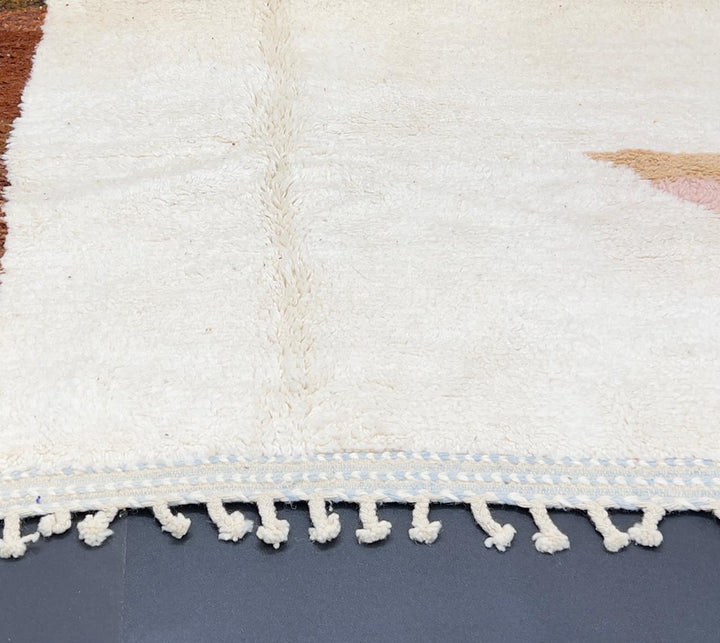 Handmade colorful Moroccan wool runner rug with geometric color-block design in green, pink, and orange tones