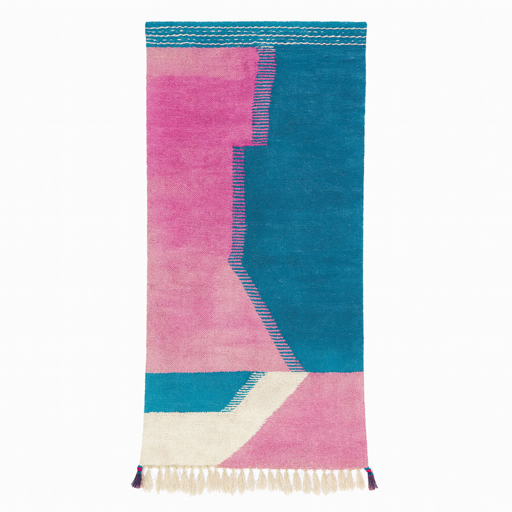 Handmade Moroccan runner rug with pink and blue geometric design, white accents and flatwoven kilim texture