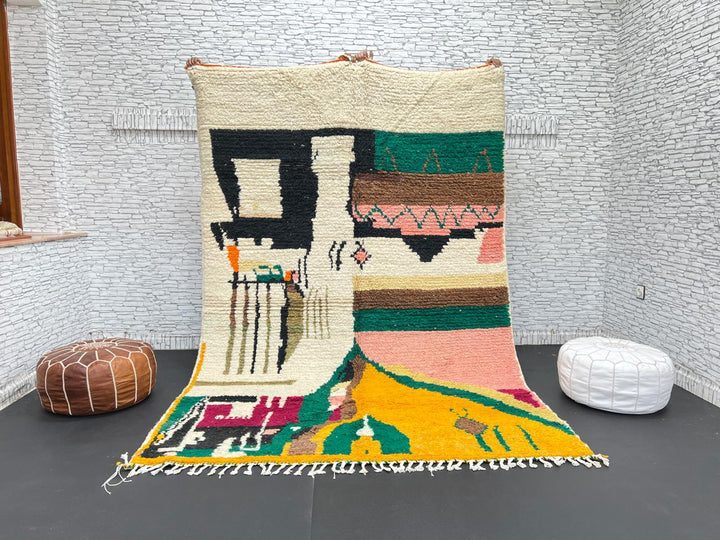 Handwoven colorful Moroccan wool rug with abstract geometric design in pink, yellow, green, and black tones