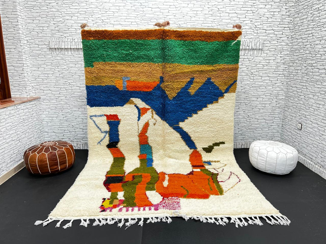 Colorful Moroccan wool rug with abstract desert and mountain design, handmade by Berber artisans
