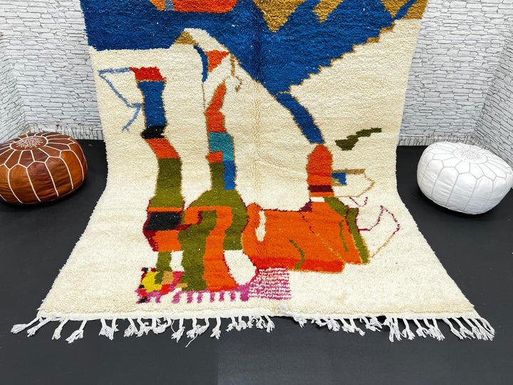 Colorful Moroccan wool rug with abstract desert and mountain design, handmade by Berber artisans