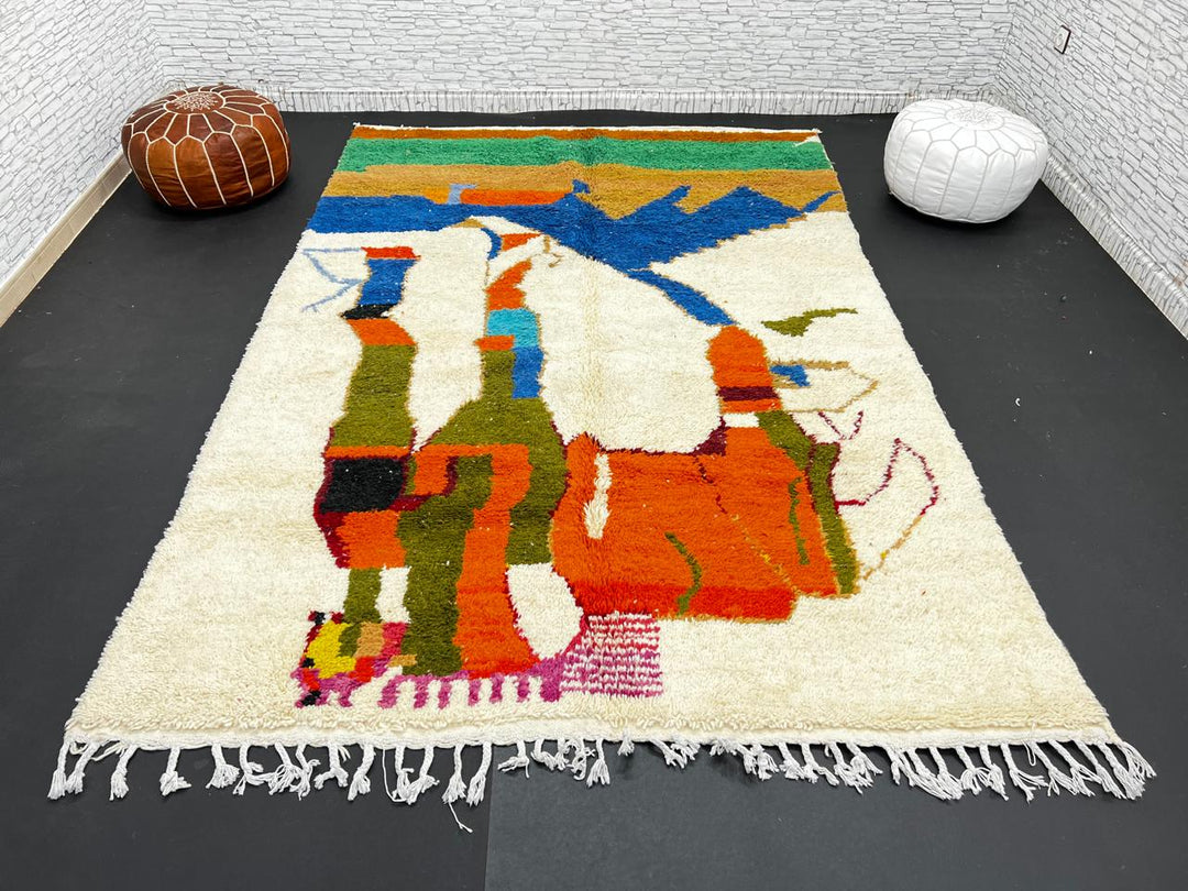 Colorful Moroccan wool rug with abstract desert and mountain design, handmade by Berber artisans