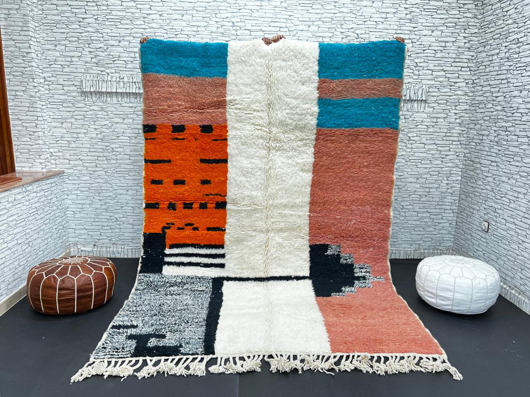 Colorful Moroccan wool rug with terracotta, turquoise blue, ivory, orange, and gray geometric color blocks