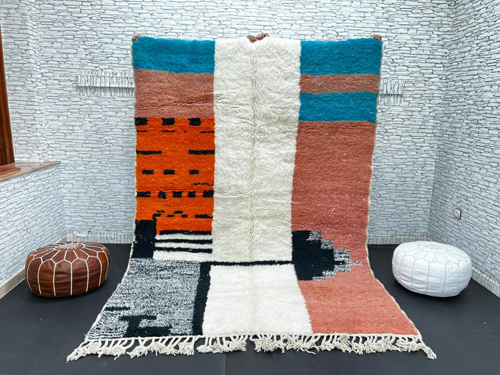 Colorful Moroccan wool rug with terracotta, turquoise blue, ivory, orange, and gray geometric color blocks